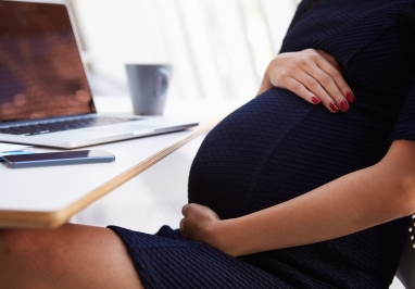 Image of Pregnant Worker at Computer